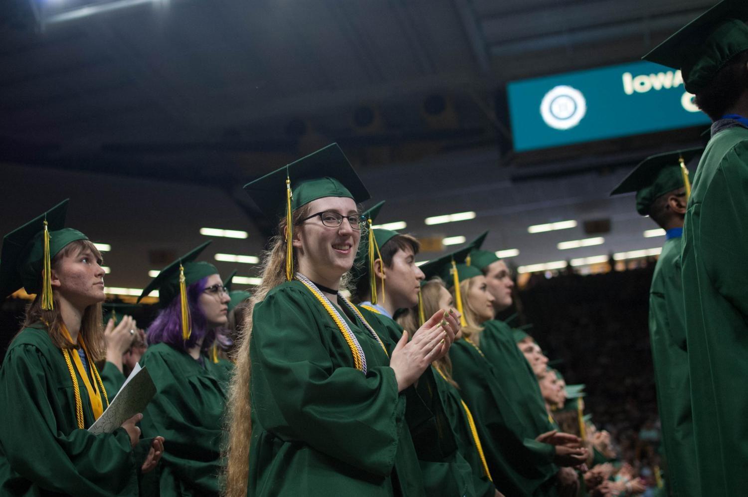 Nicole Ritchey 17 applauds during the West High commencement ceremony at Carver-Hawkeye Arena on May 27.
