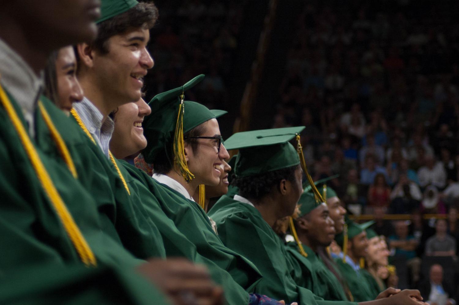 Nasim Abu-Dagga '17 laughs at Commencement Speaker and social studies teacher, Dominic Iannone's, joke about the French Wars of Religion on May 27 at Carver-Hawkeye Arena. 