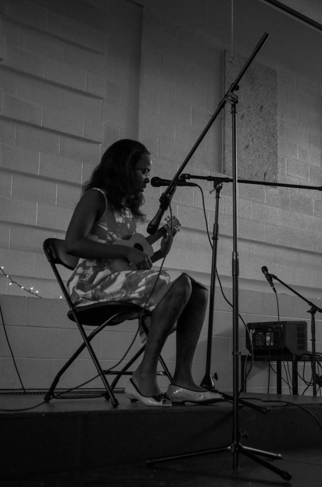 Helping to start off the fundraising Music Playathon, Eman Elshiekh '18 performs second with Grace Wang '19 in the West High Cafeteria on May 20.