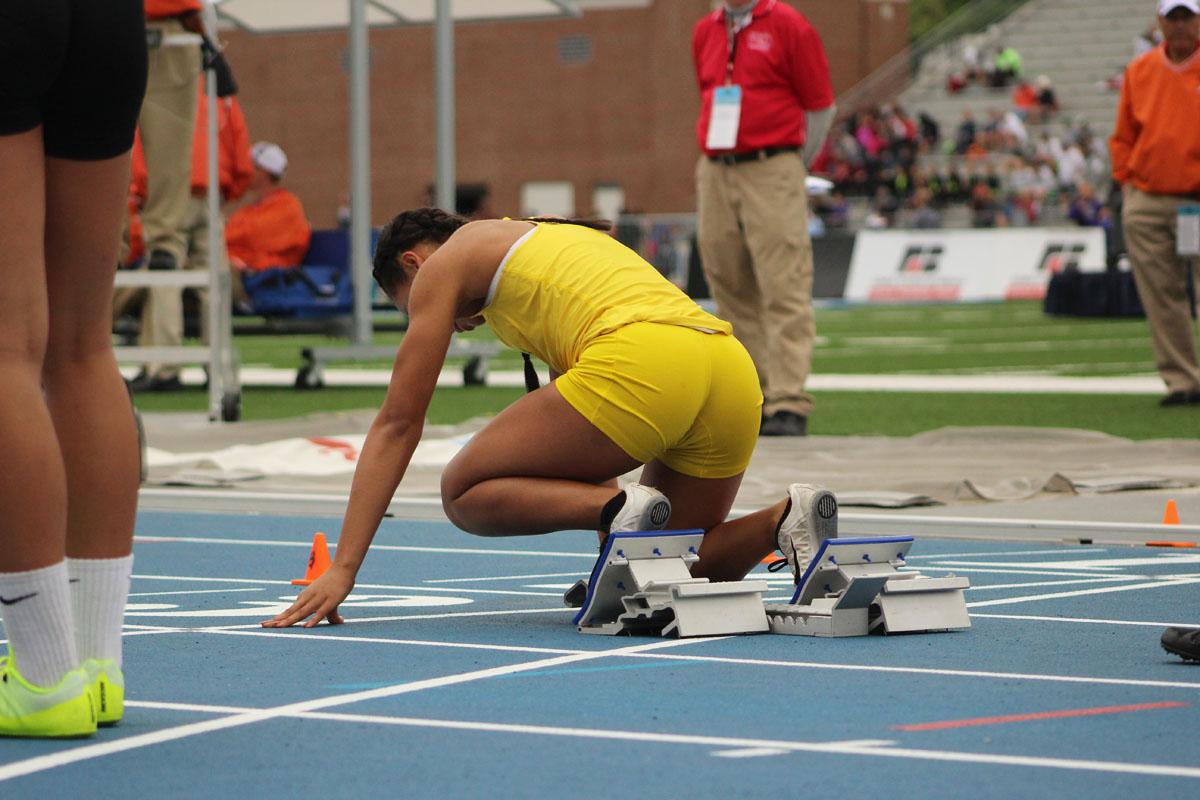 Kitra Bell '18 gets ready for the shuttle hurdle relay prelims. 