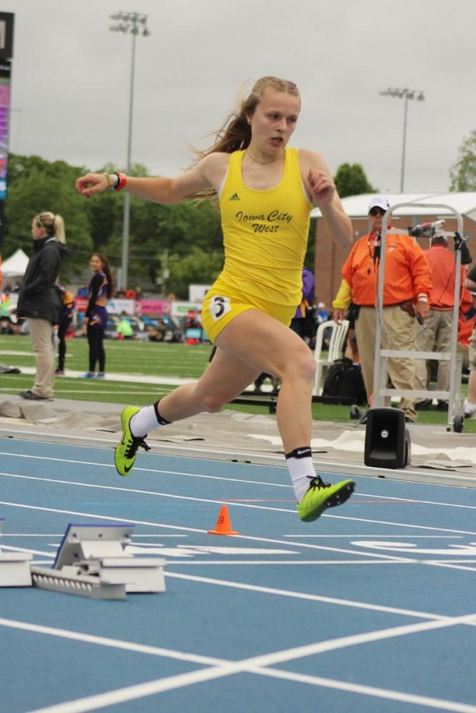 Peyton Steva '19 crosses the line during the shuttle hurdle relay prelims. 