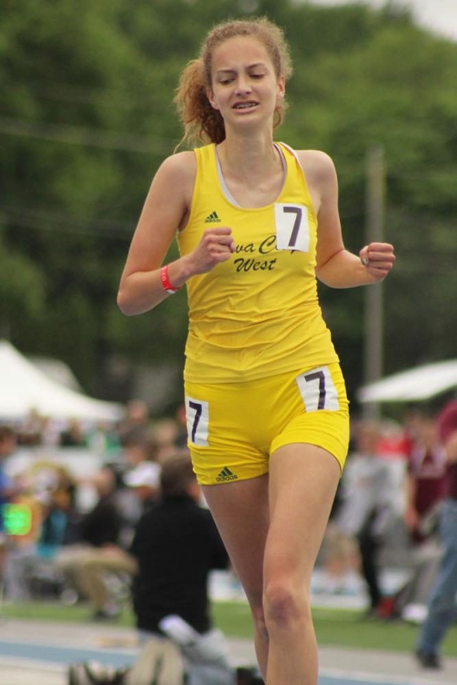 Bailey Nock '18 celebrates as she wins the 3,000 meter run. 