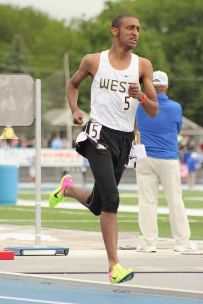 Ali Ali '17 runs during the 3,200 meter run, where he got 5th place. 