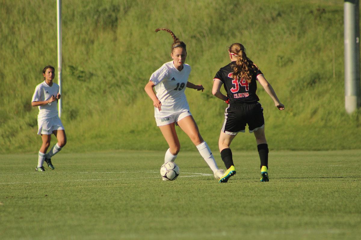 Rachel Olson '19 dribbles around Clinton's Megan Gandrup '19. 