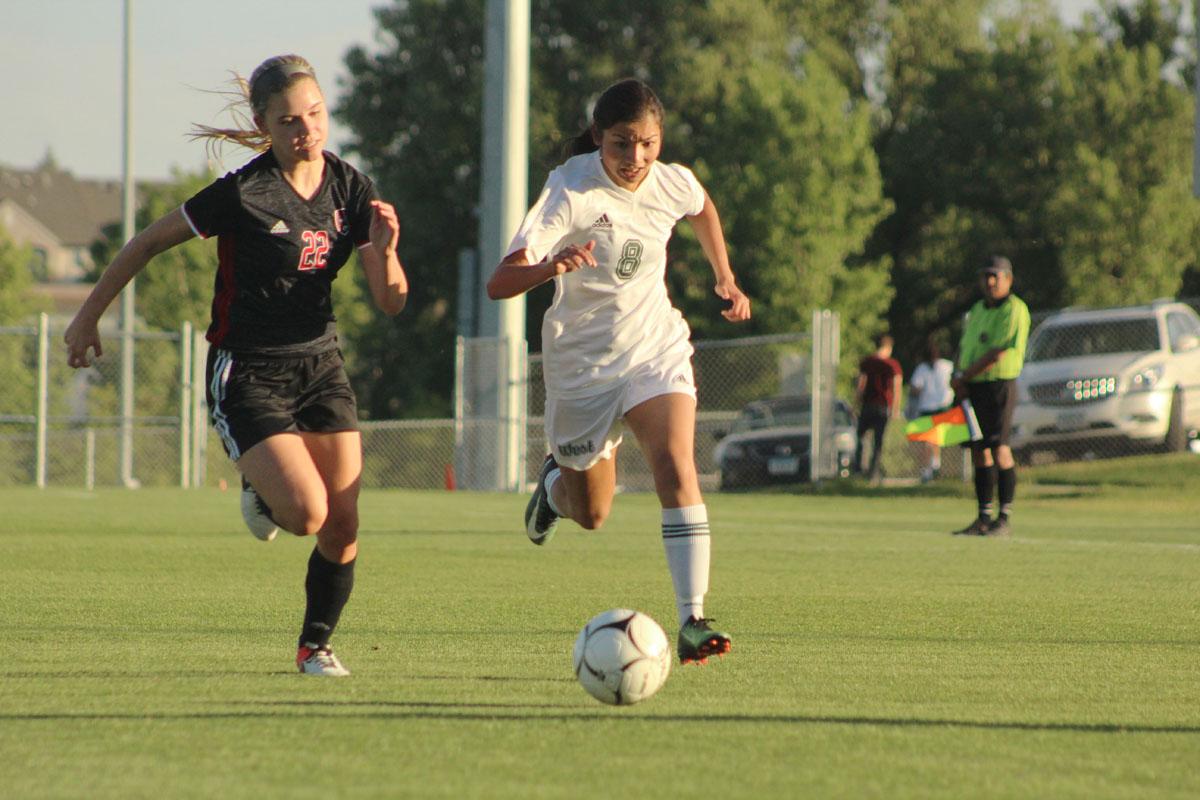 Abby Zimmerman '17 fights for the ball against Keegan Cassidy '18 of Clinton.