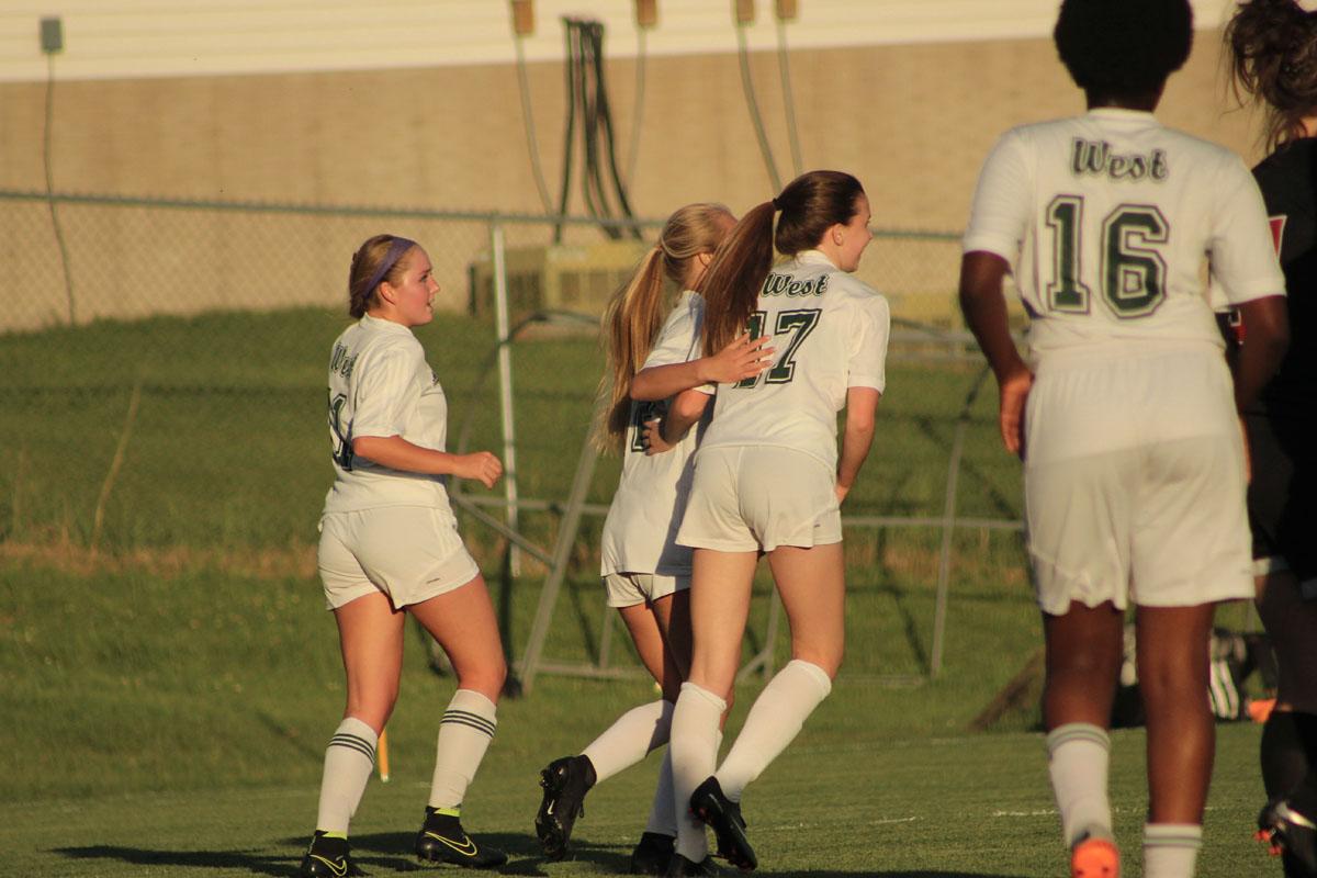 Hannah Cantrell '19 gives Lizzie Raley '19 a hug after Raley scored the last goal of the game.