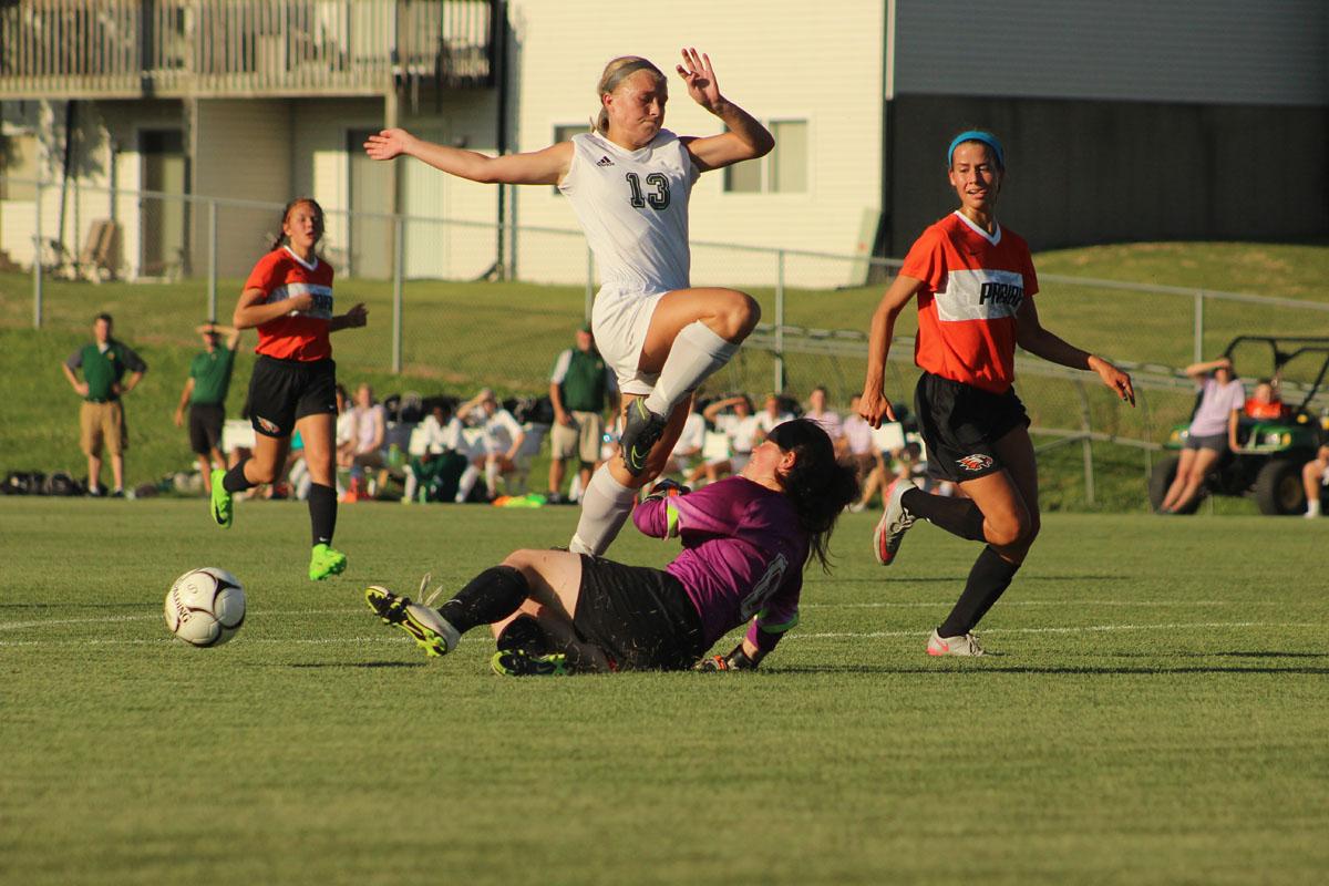 Emma Cooper '17 tries to score against Prairie's McKenna Wilson '18.