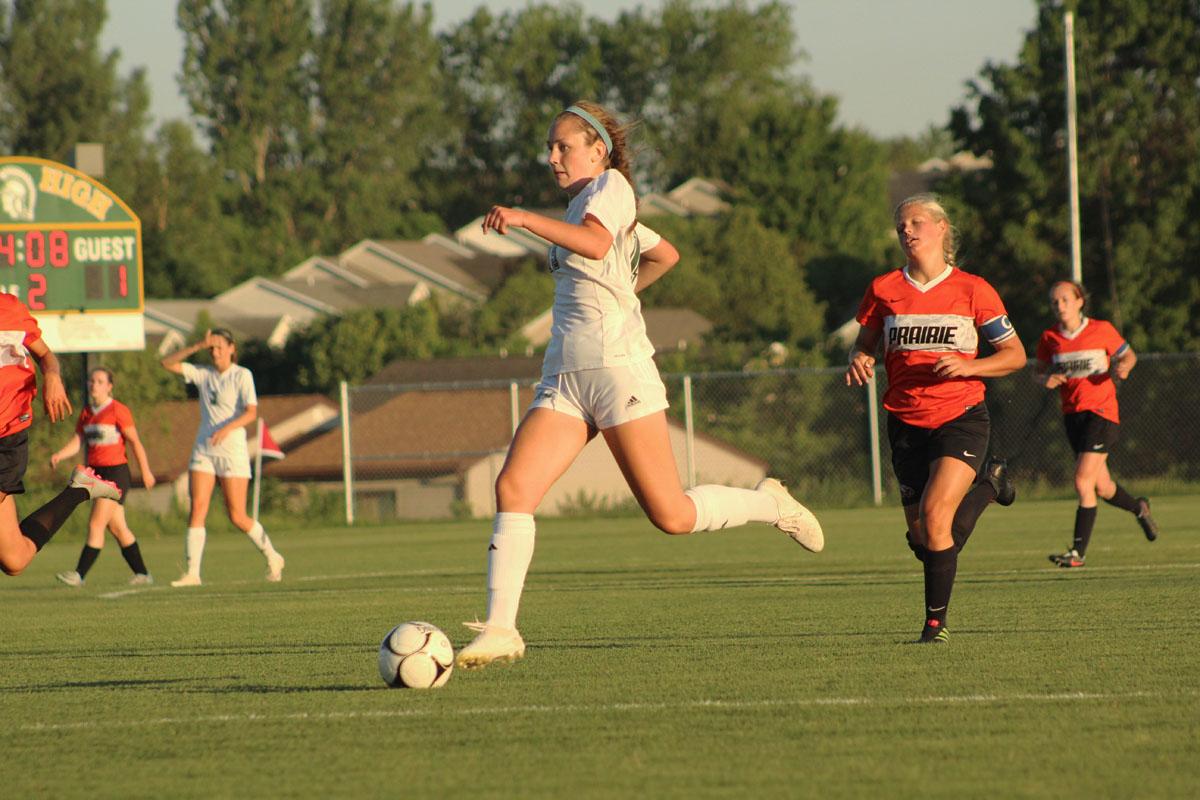 Rachel Olson '19 dribbles the ball to score the fourth goal of the game.