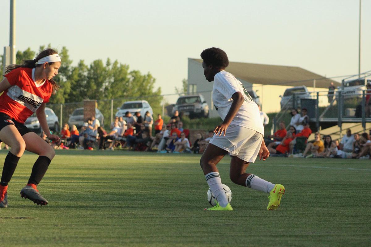 Pauline Kihura '20 passes the ball around Prairie's Nyah Engstrom '20. 