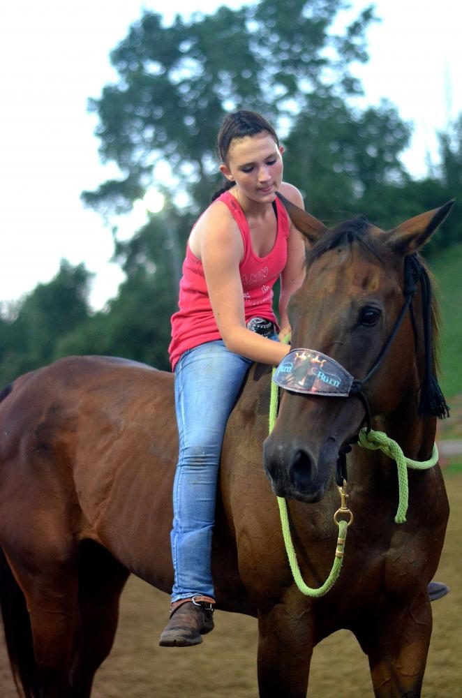 A rider and her horse pause during the Johnson County Fair Rodeo on July 27 in Iowa City. 