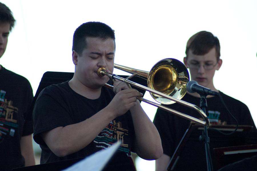 Nathan Tansey 18 plays a trombone solo on the Main Stage of the Iowa City Jazz Festival as a part of the United Jazz Ensemble on June 30. 
