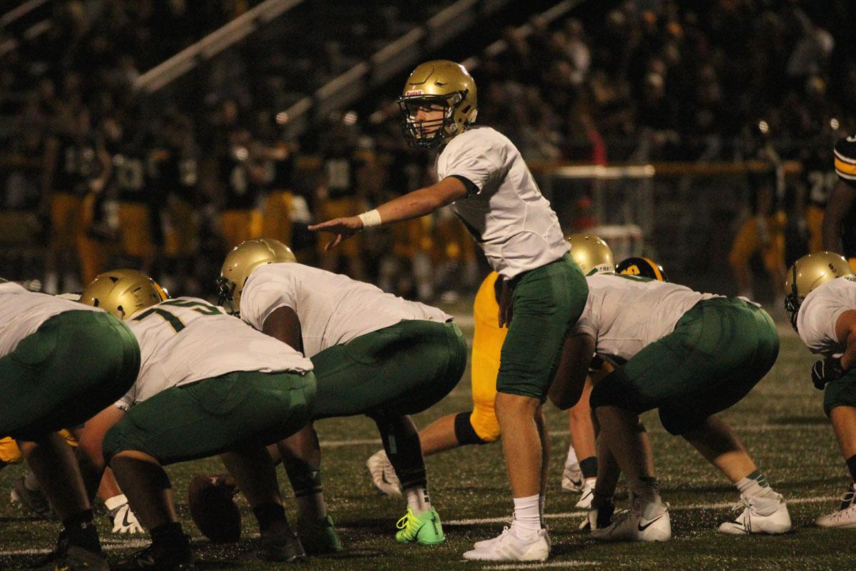 Evan Flitz '18 calls out a play to the offense on Friday, Aug. 25. 