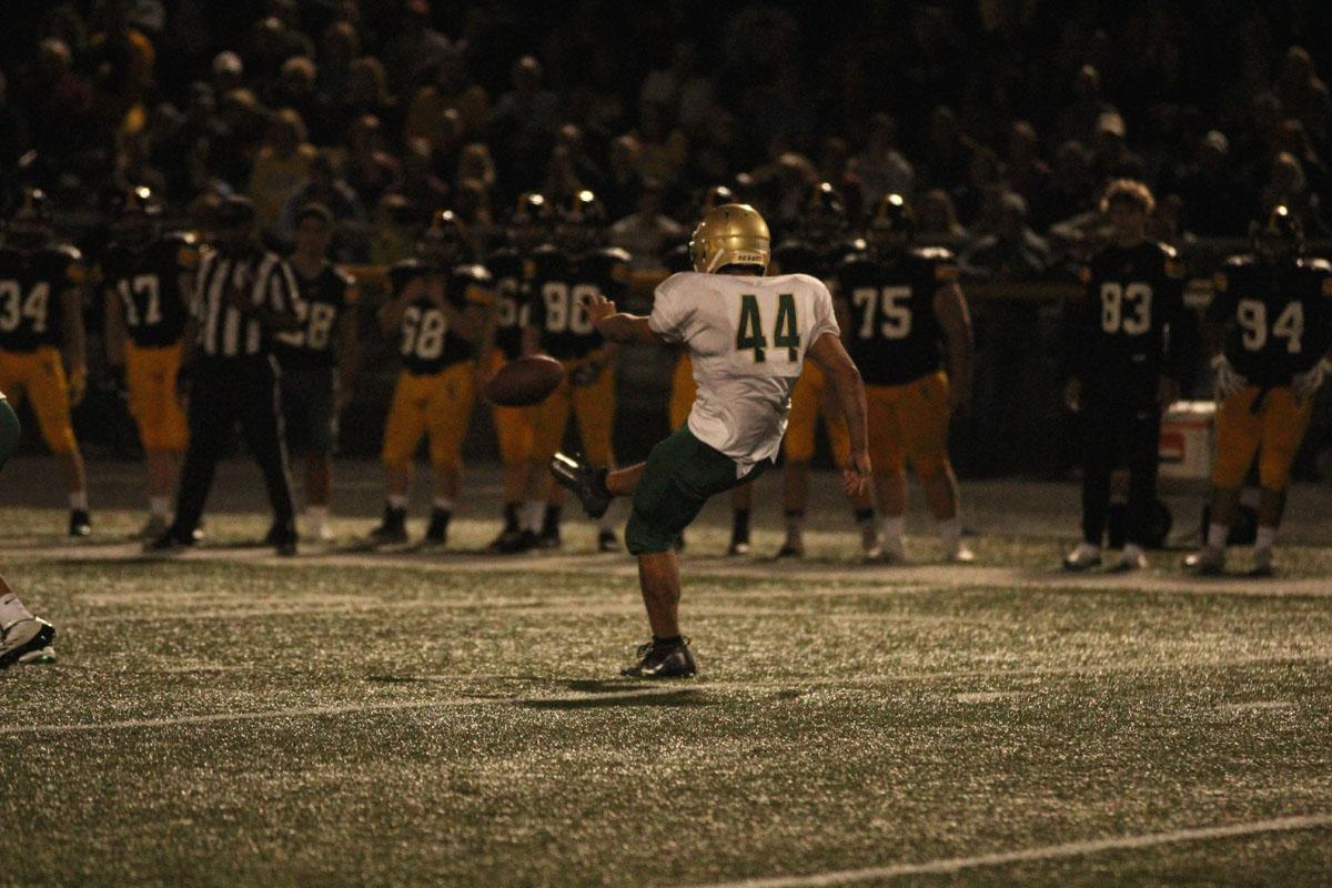 Landon Green '19 punts the ball to Southeast Polk during the third quarter on Friday, Aug. 25. 