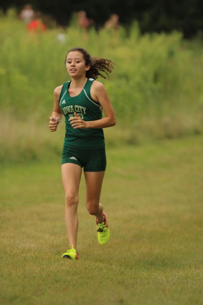 Vana Slattery '20 runs towards the first mile marker during the JV race. She placed eighth with a time of 23:43.