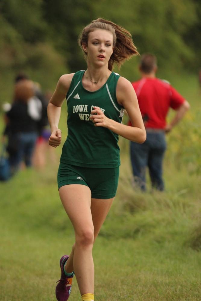 Chloe Holt '19 runs past the second mile mark during the JV race. She placed fourth with a time of 22:09. 