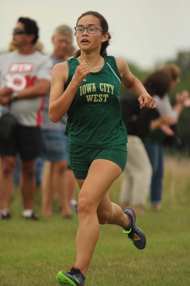 Emma Kearney '21 runs towards the finish line during the JV race. She placed 16th with a time of 24:55.