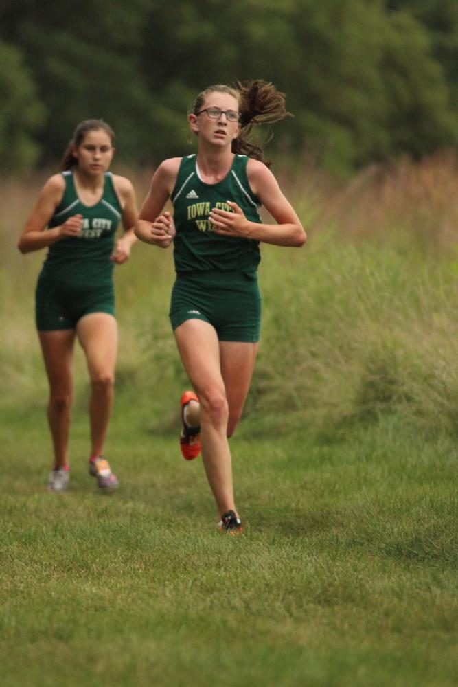 Erica Buettner '21 goes to the second mile marker during the varsity race. She placed fifteenth with a time of 21:29.