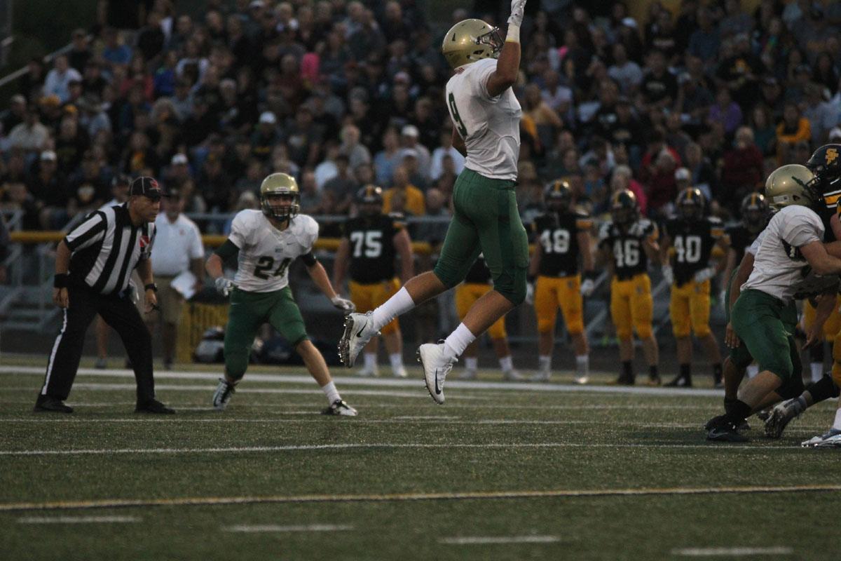 Dillion Doyle '18 tries to intercept the ball during the first quarter on Friday, Aug. 25. 