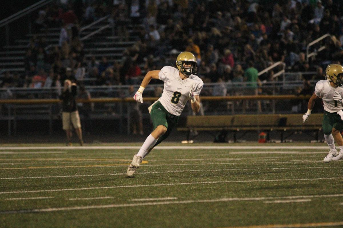 Austin Geasland '18 runs up the field during a kickoff on Friday, Aug. 25.