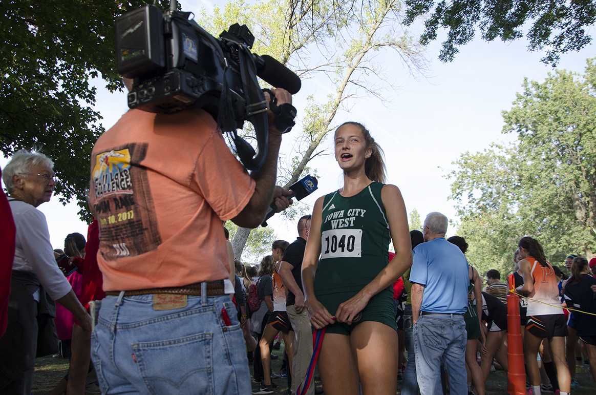 Post race, Bailey Nock 18 is interviewed by KCRG for placing first at the Cedar Rapids Invite at Noelridge Park on Sept. 7.