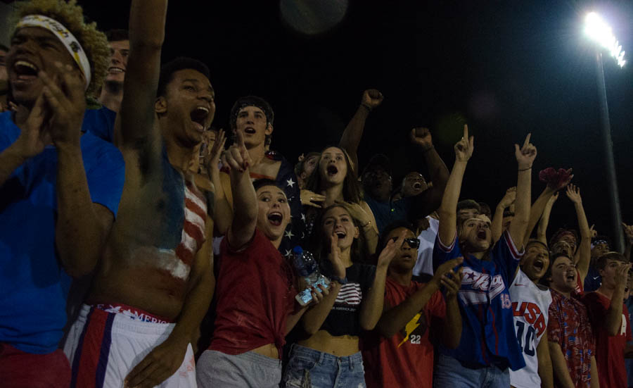 The student section erupts into excitement as West High scores a touchdown.