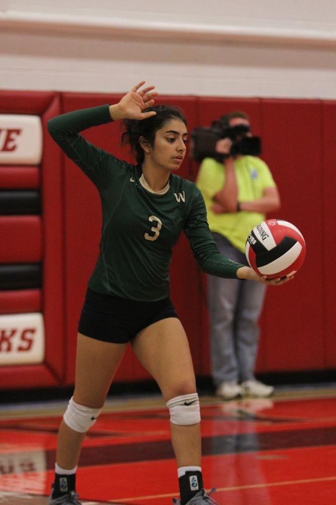 Khushi Kapoor '18 sets up to serve the ball on Tuesday, Sept. 5. 