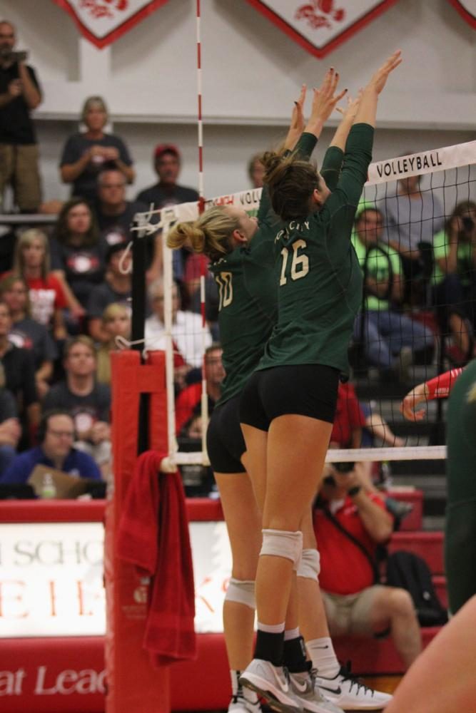 Maddie Laffey '18 and Emily Burtch '18 jump to block the ball on Tuesday, Sept. 5.