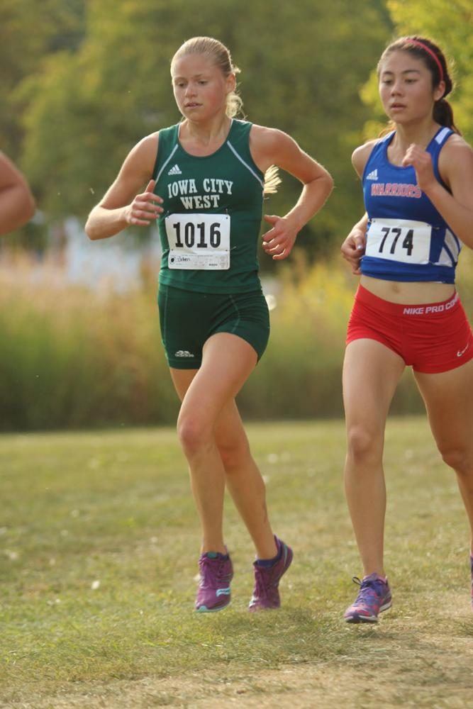 Colleen Bloeser '18 passes another runner. She placed 7th with a time of 19:34 on Thursday, Sep. 7.