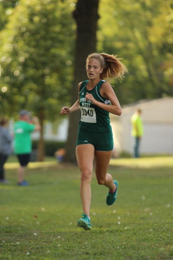 Bailey Nock '18 sprints down to the finish line. She placed 1st and set a new course record with a time of 18:18 on Thursday, Sep. 7.