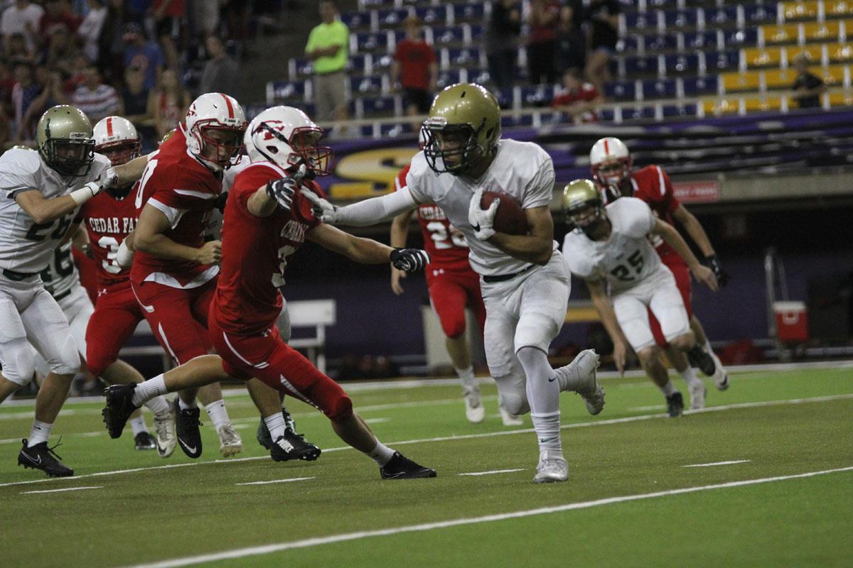 Andre White '17 runs the ball down the field after a punt return on Friday, Sep. 8. 