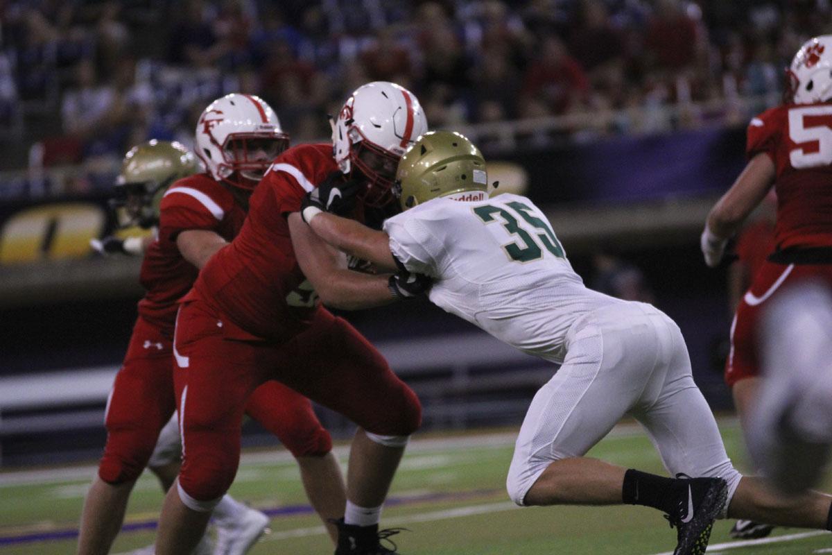 Quinn Baker '18 blocks a player from Cedar Falls on Friday, Sep. 8. 