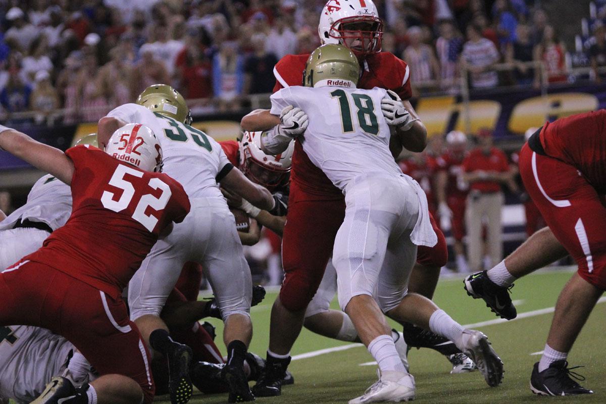 Cole Mabry '19 pushes a player from Cedar Falls on Friday, Sep. 8. 