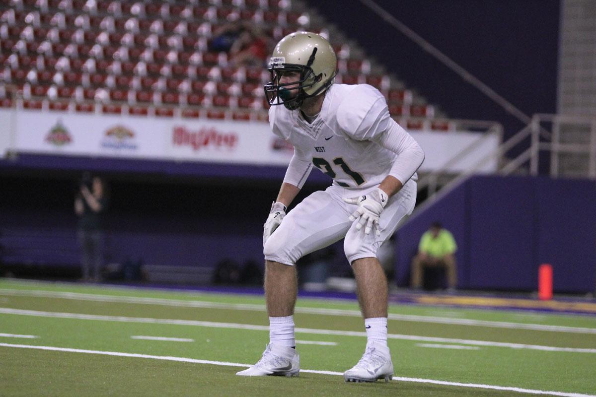 Nick Biancuzzo '19 waits for Cedar Falls to snap the ball on Friday, Sep. 8.