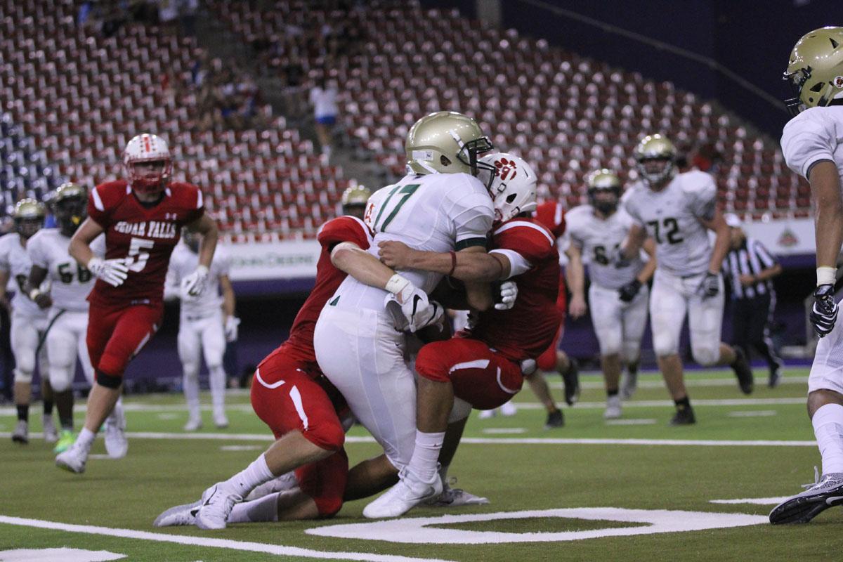 Jalen Gaudet '19 gets tackled with the ball on Friday, Sep. 8. 