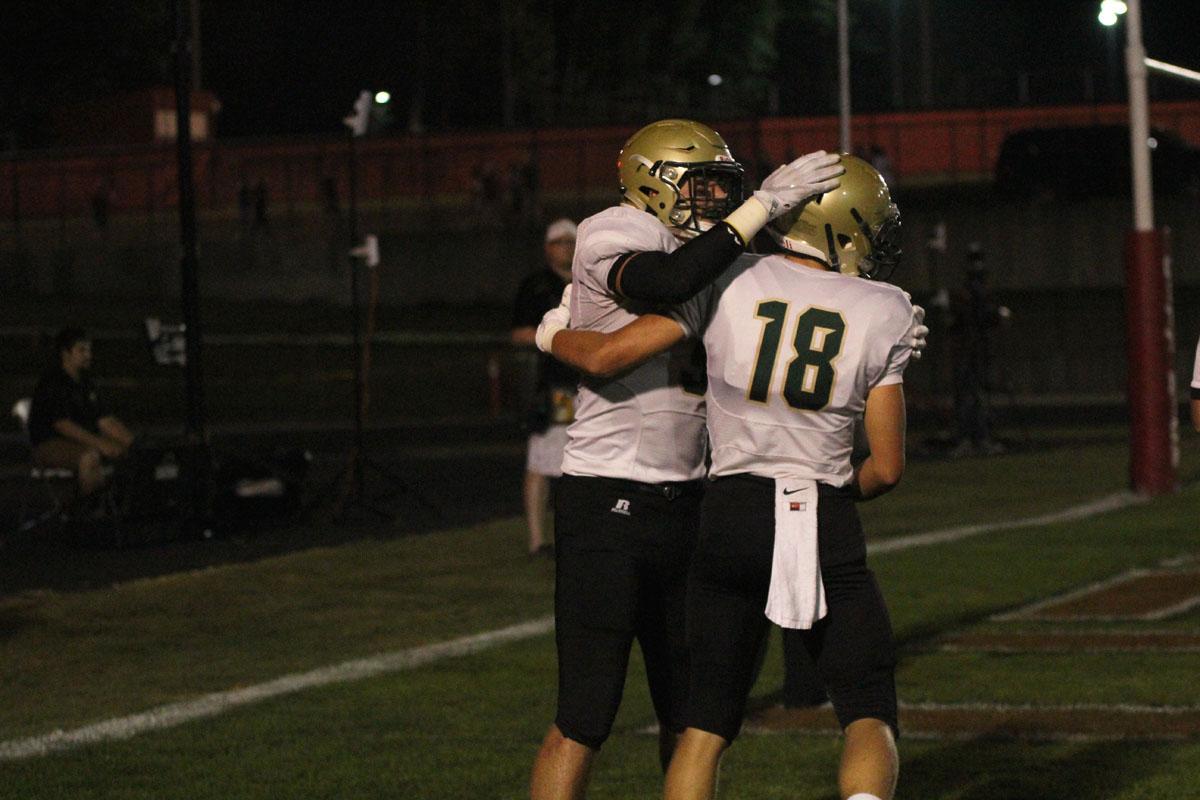 Dillon Doyle '18 hugs Cole Mabry '19 after Mabry scored a touchdown making the score 24-0 on Friday, Sep. 15.