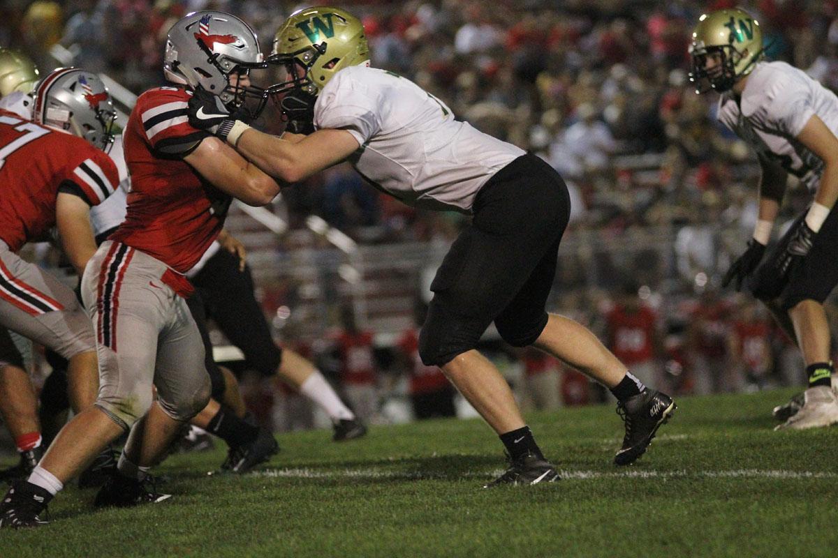 Josh Halverson '19 blocks a player from City on Friday, Sep. 15.