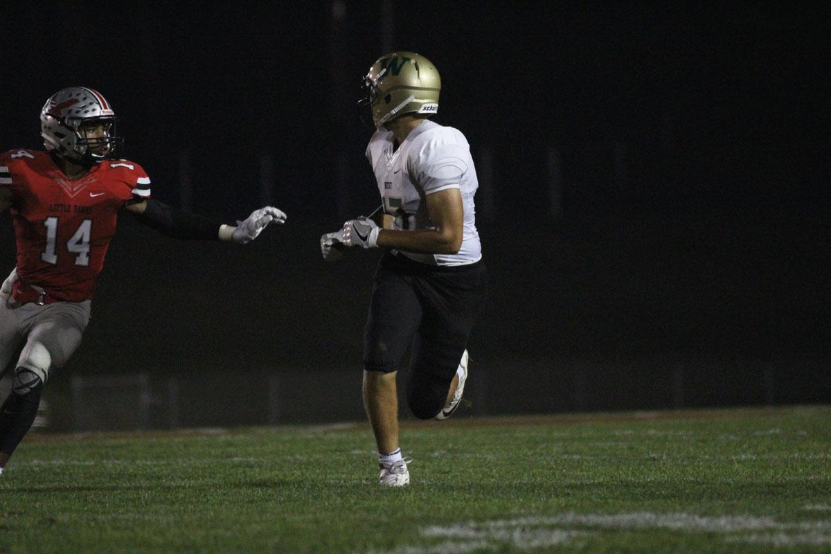 Jalen Gaudet '19 turns around to look for a pass from Evan Flitz '18 as City's Chris Johnson '18 runs to cover Gaudet on Friday, Sep. 15.