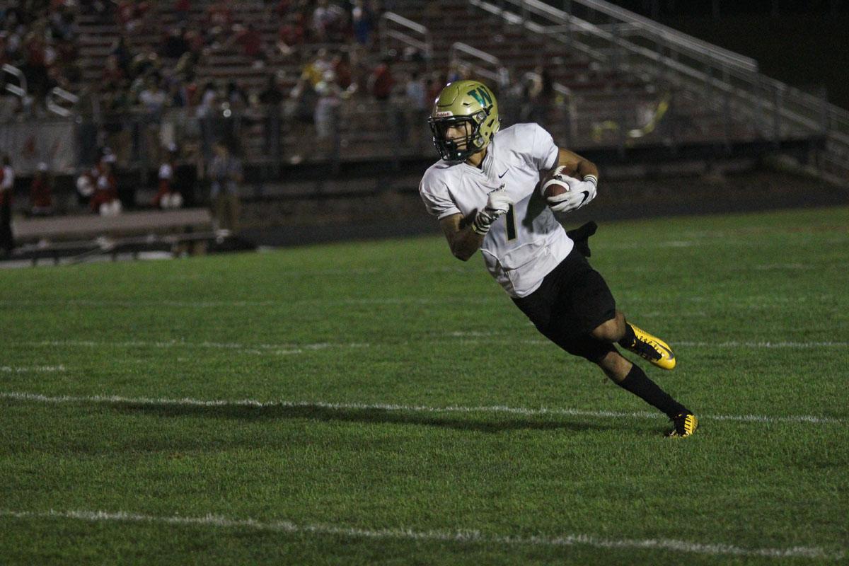 Traeveis Buchanan '18 runs for a West first down on Friday, Sep. 15. 