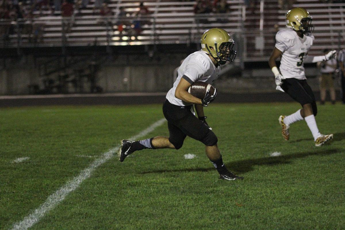 Andre White '18 runs towards the end zone after a City High kickoff on Friday, Sep. 15.