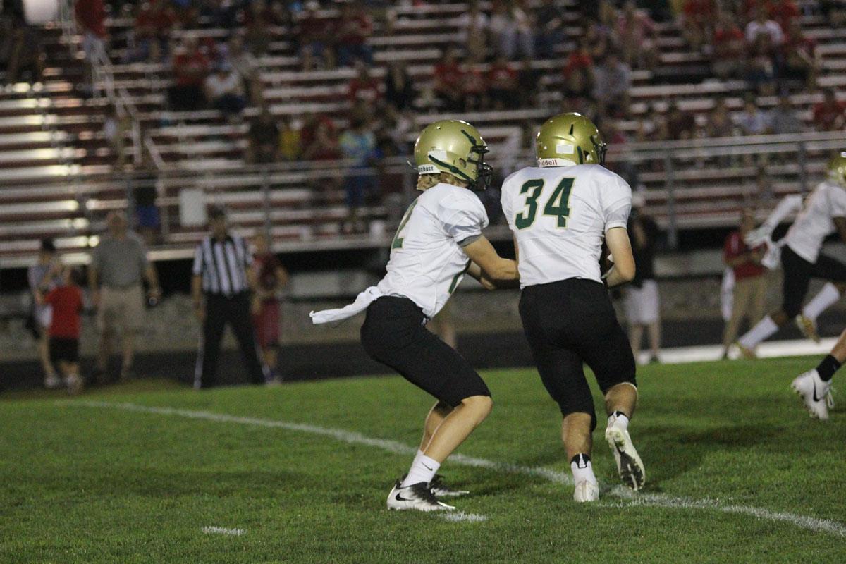 Noah Aanestad '19 hands the ball to Peter Breitbach '19 on Friday, Sep. 15.