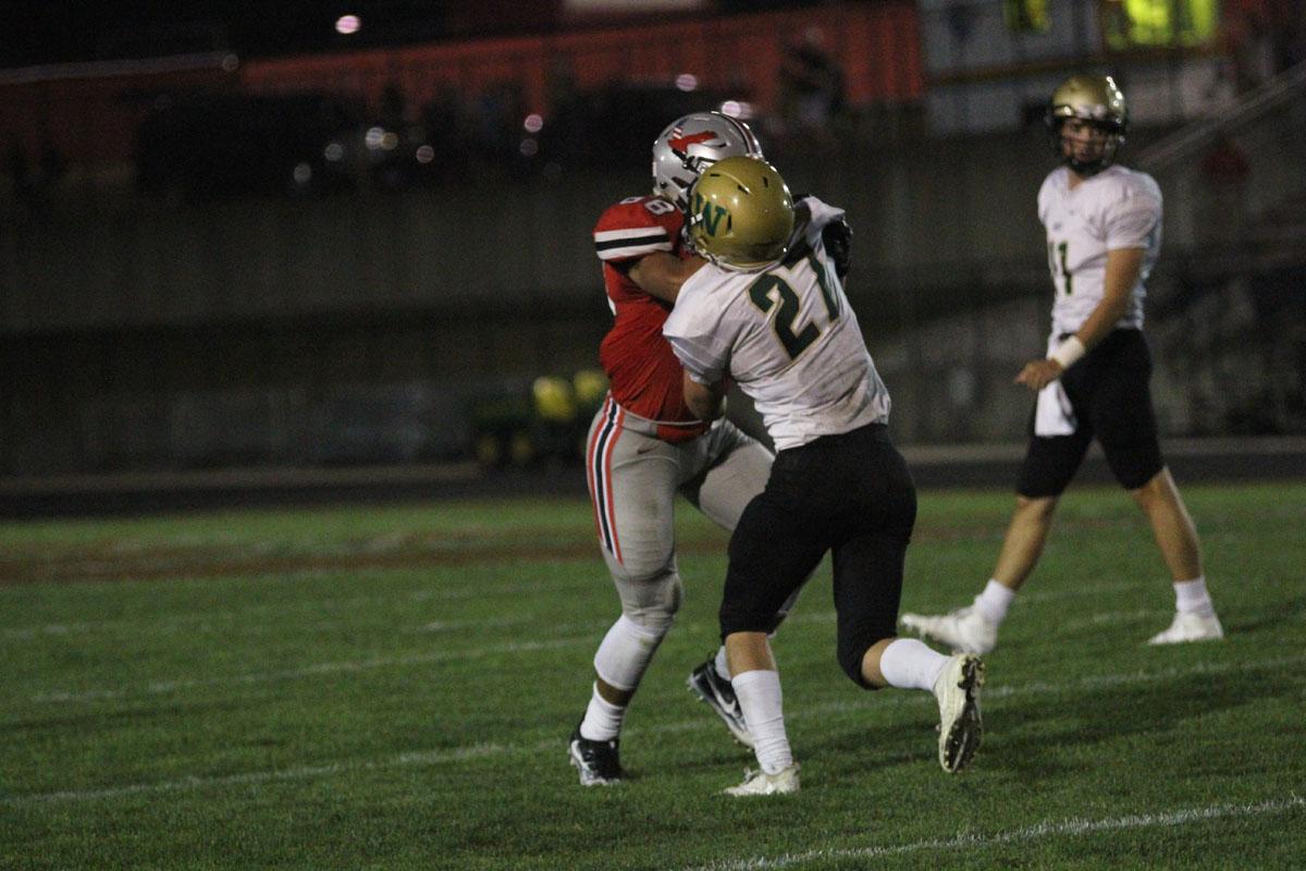 Ethan McAreavy '18 blocks City's Doug Burtch '19 on Friday, Sep. 15.