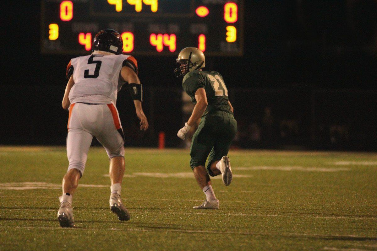 Nick Biancuzzo '19 moves back to defend Prairie's Izaak Lindgren '19 on Friday, Sep. 22.