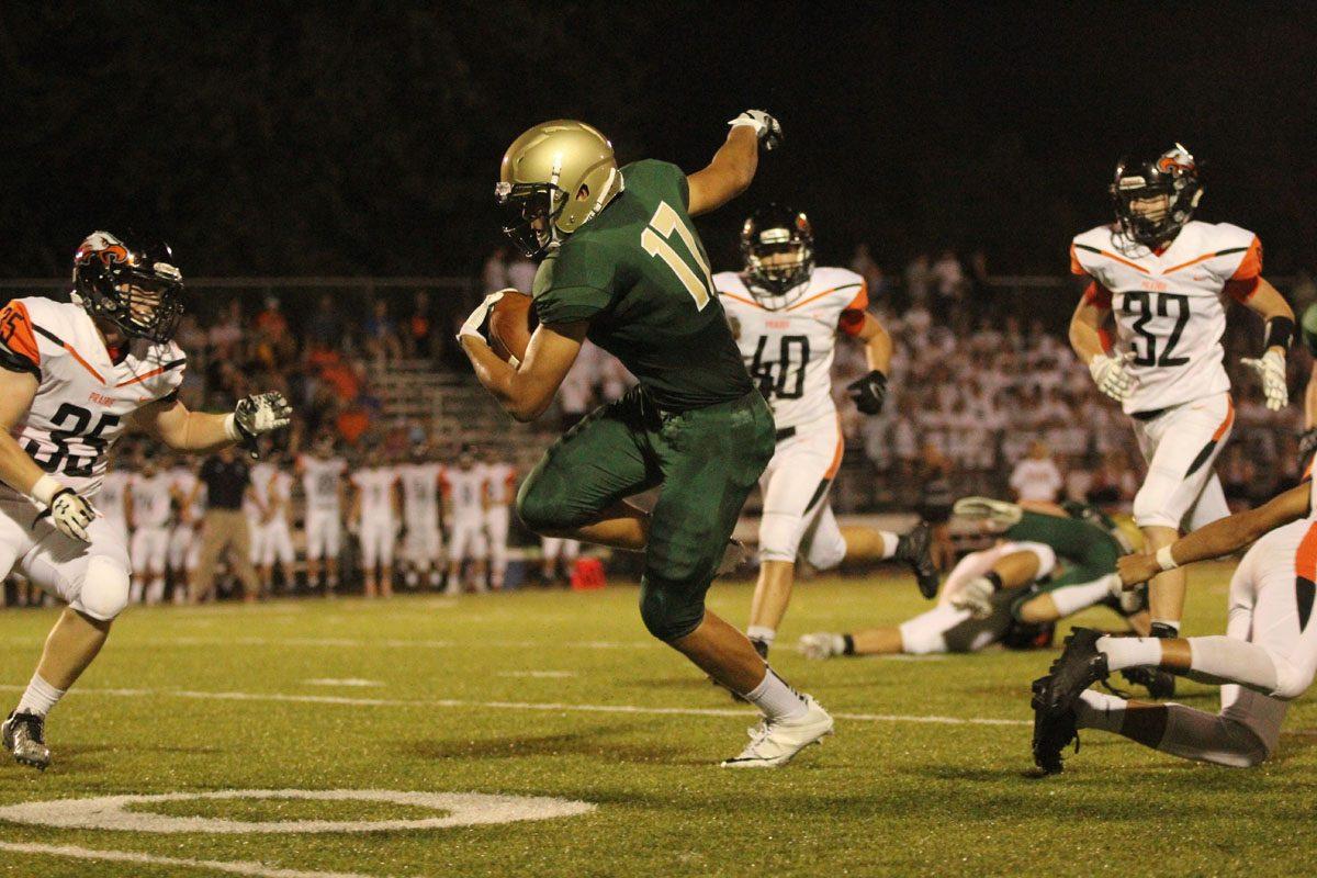 Jalen Gaudet '19 dodges a defender from Prairie as he carries the ball up the field on Friday, Sep. 22.