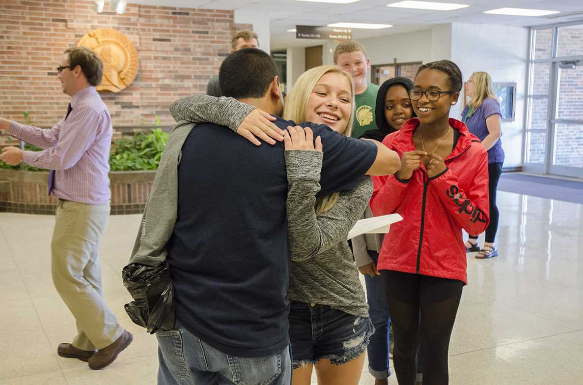 Lexi Goodale 19 hugs Carlos after he received the Shine Award on Sept. 13 in the main commons. 