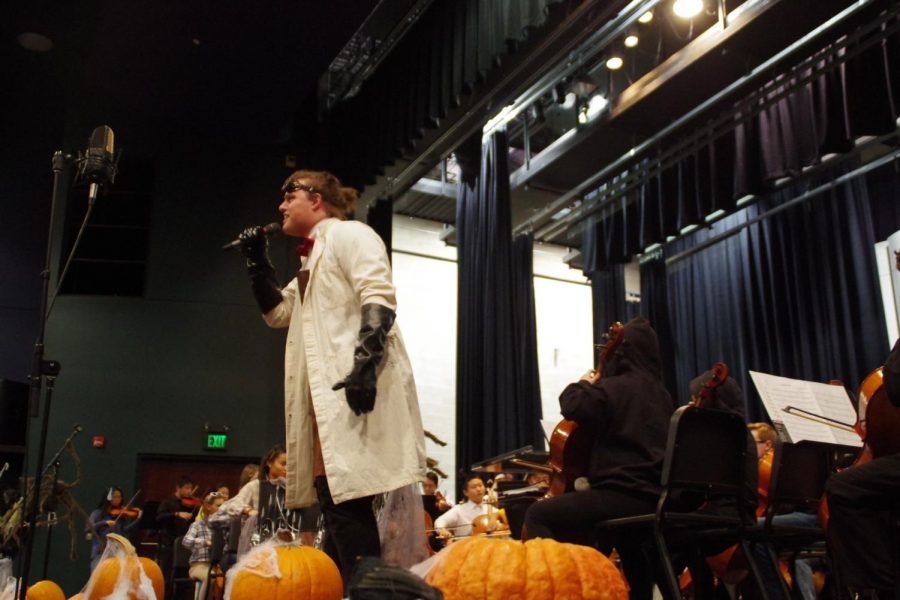 Ethan Seylar 18 sings Monster Mash with the combined Northwest and West High orchestras at the Halloween fundraising concert on Oct. 26. 