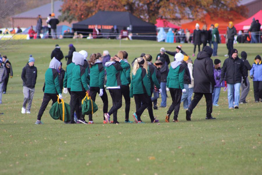 The girls team heads over to the start line on Saturday, Oct. 28.