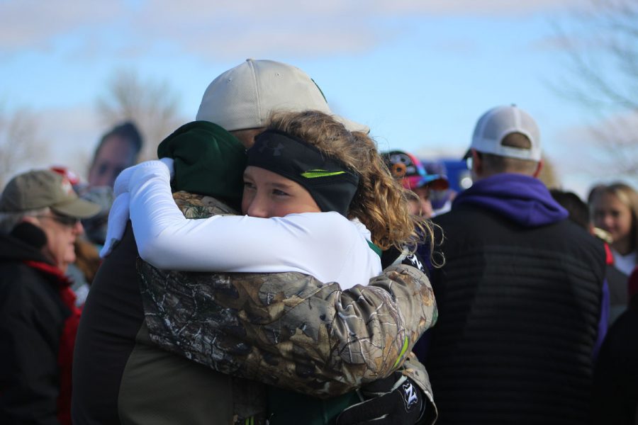 Lucy Westemeyer '21 hugs her dad after she placed 116th with a time of 21:03 on Saturday, Oct. 28.