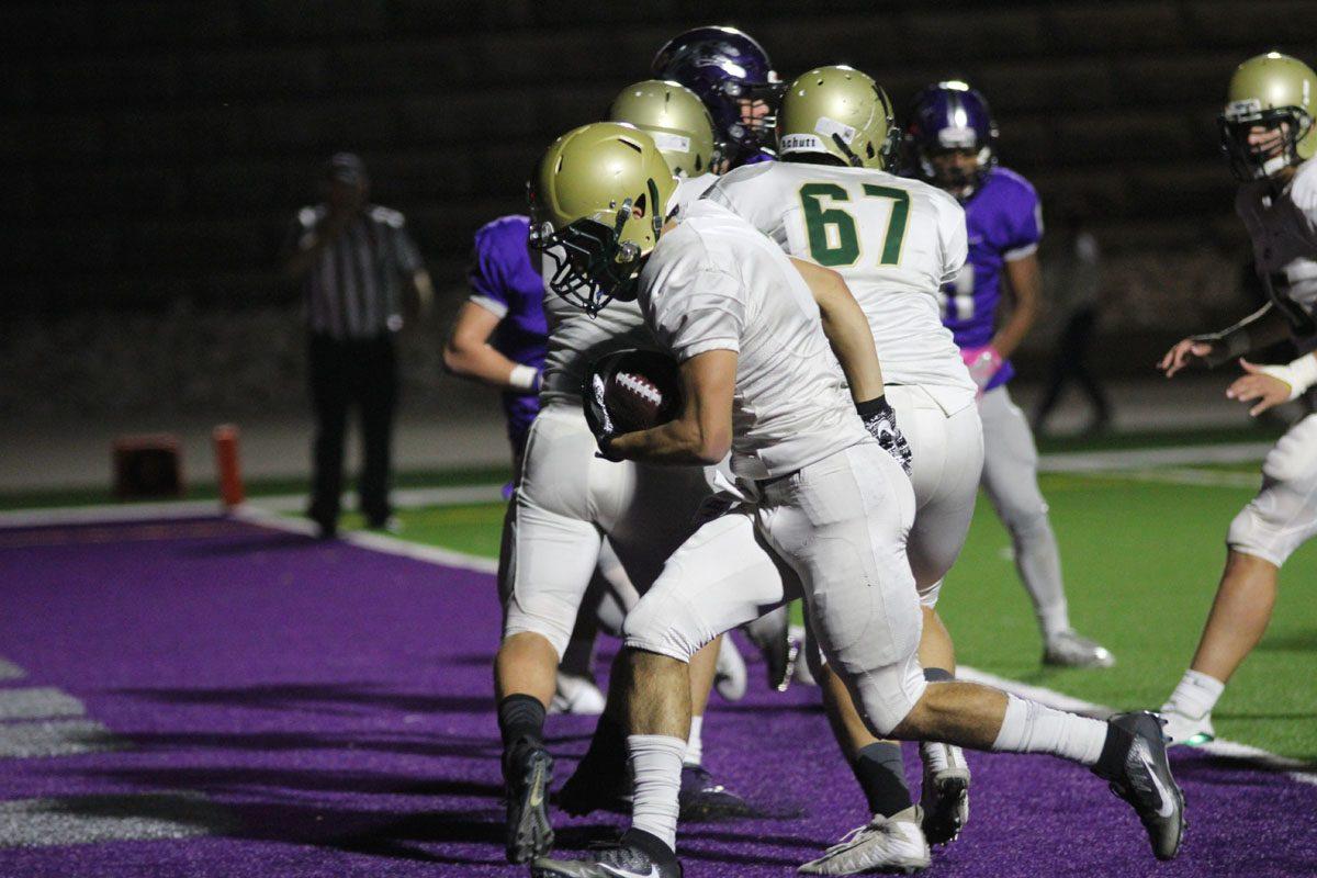 Andre White '18 crosses into the end zone for a Trojan touchdown on Friday, Sep. 29.