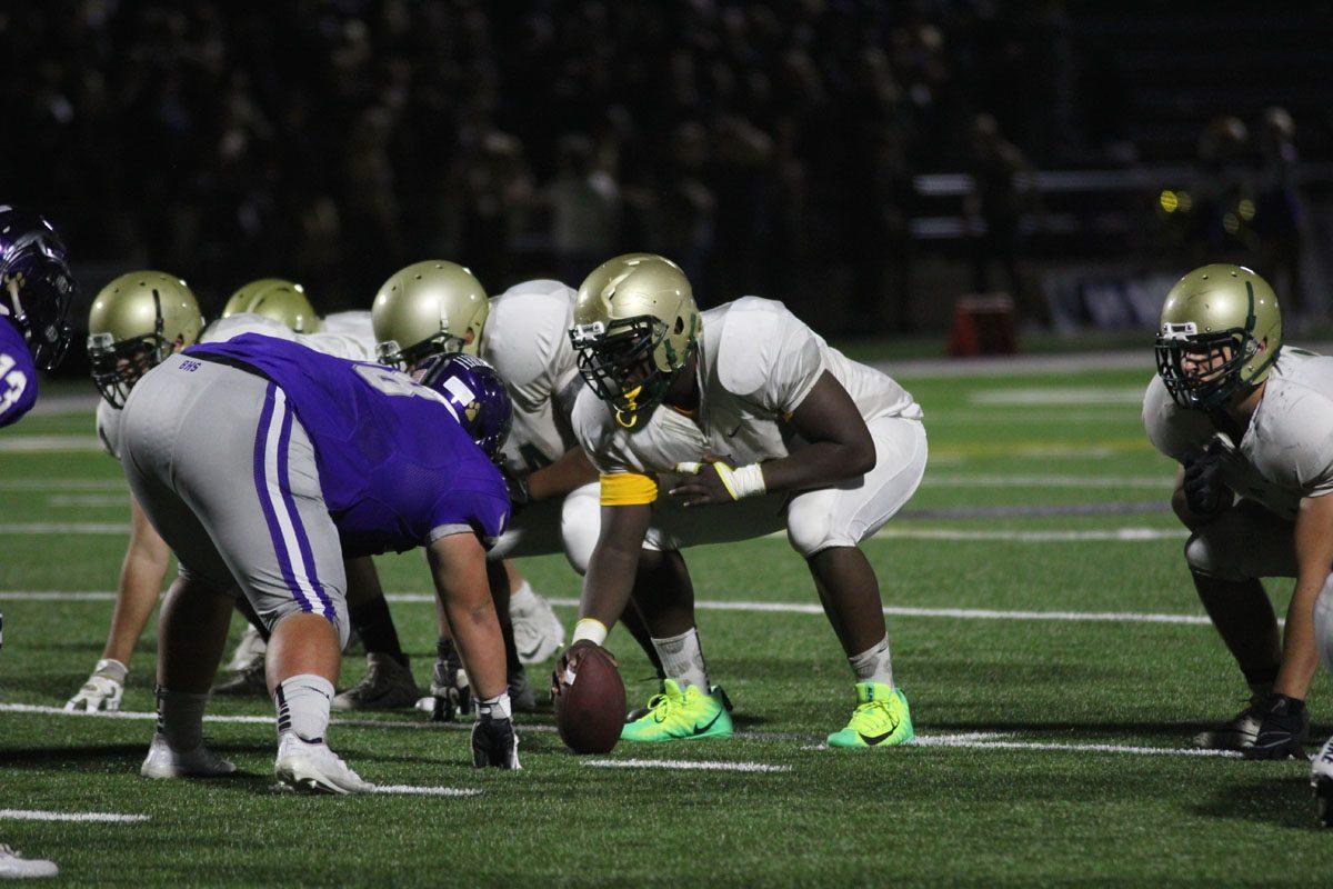 Guy Snow '18 prepares to hike the ball to Evan Flitz '18 on Friday, Sep. 29.