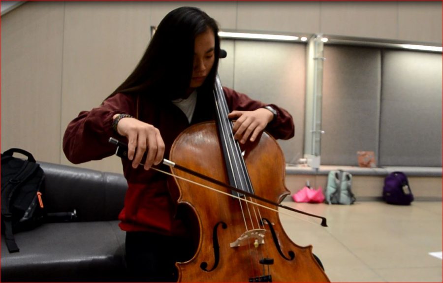 Along with band members, orchestra and choir students will audition for spots into All-State on Oct. 21. Above, Meleah Chang 18 practices for a mock audition at the All-State Strings Workshop on Oct. 14 at the Voxman Music Building. 